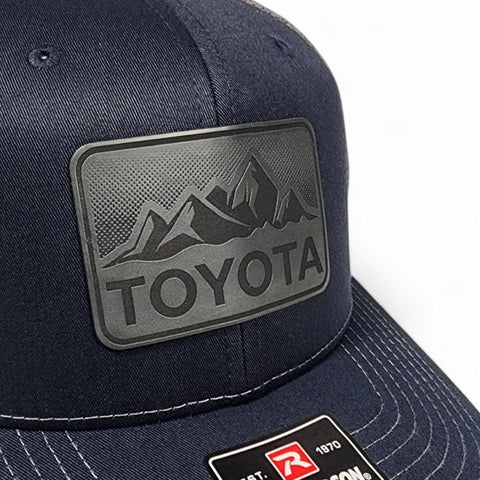 Navy / Charcoal Toyota Mountains Laser Engraved Vintage Style Leatherette Patch Trucker Richardson 112 Hat Cap